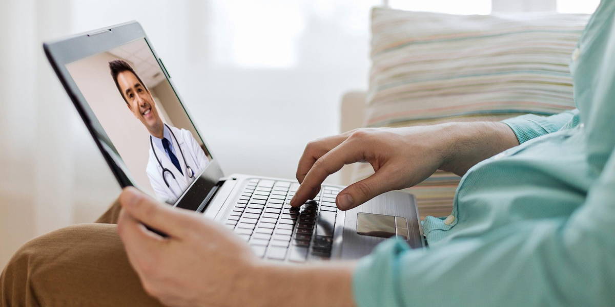 patient having video call with doctor on laptop