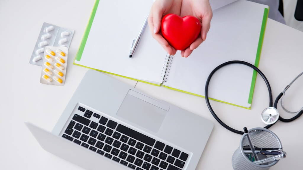 Doctor checking up heart in medical concept