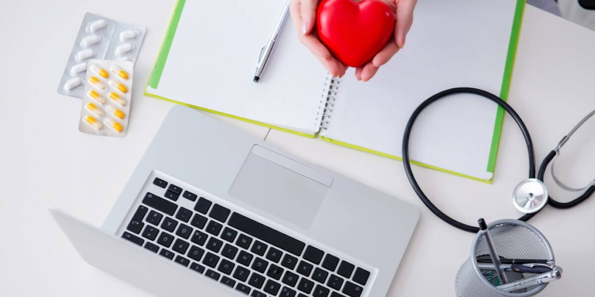 Doctor checking up heart in medical concept