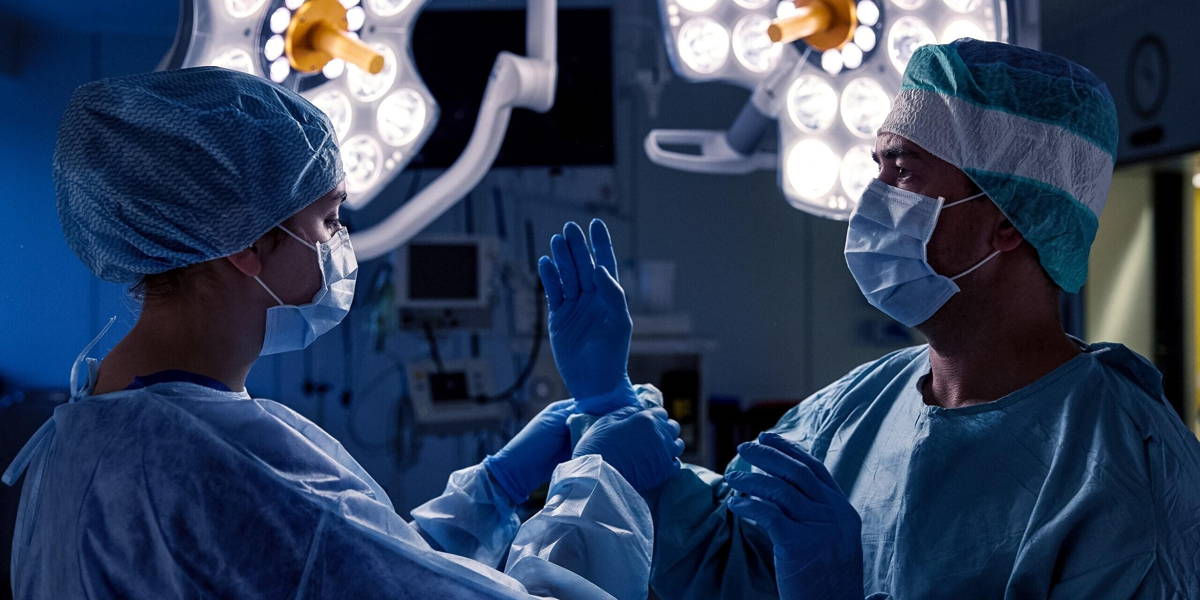 surgeons in operating room at hospital