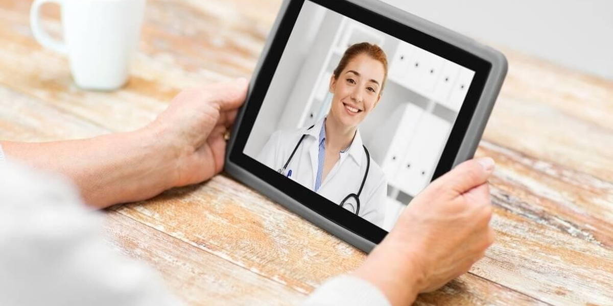 senior woman patient having video call with doctor