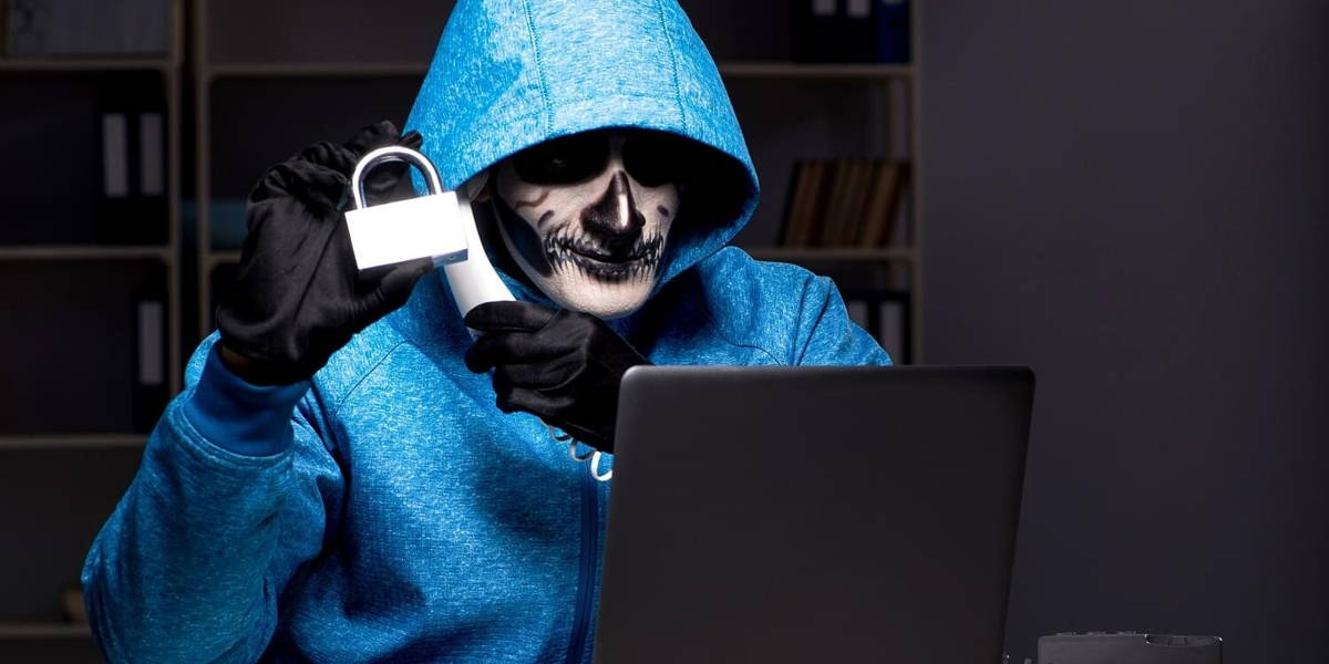 Scary hacker hacking security firewall late in office