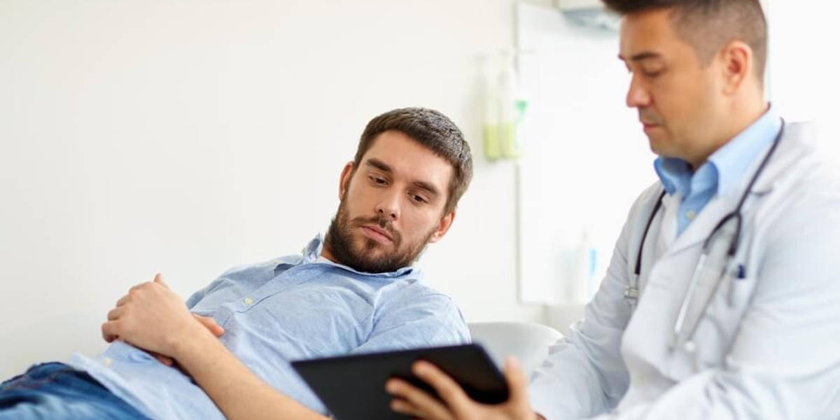 doctor and man with health problem at hospital