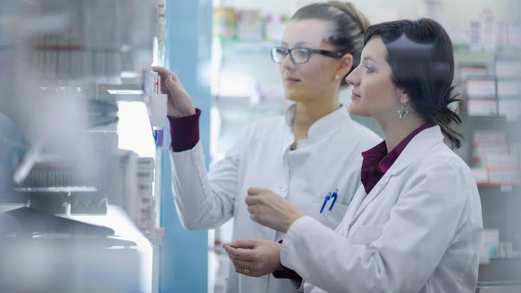 team of pharmacist chemist woman  in pharmacy drugstore