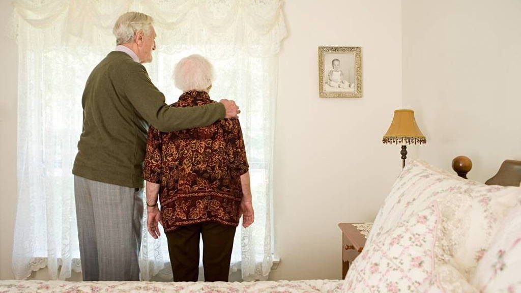 Elderly couple in their bedroom