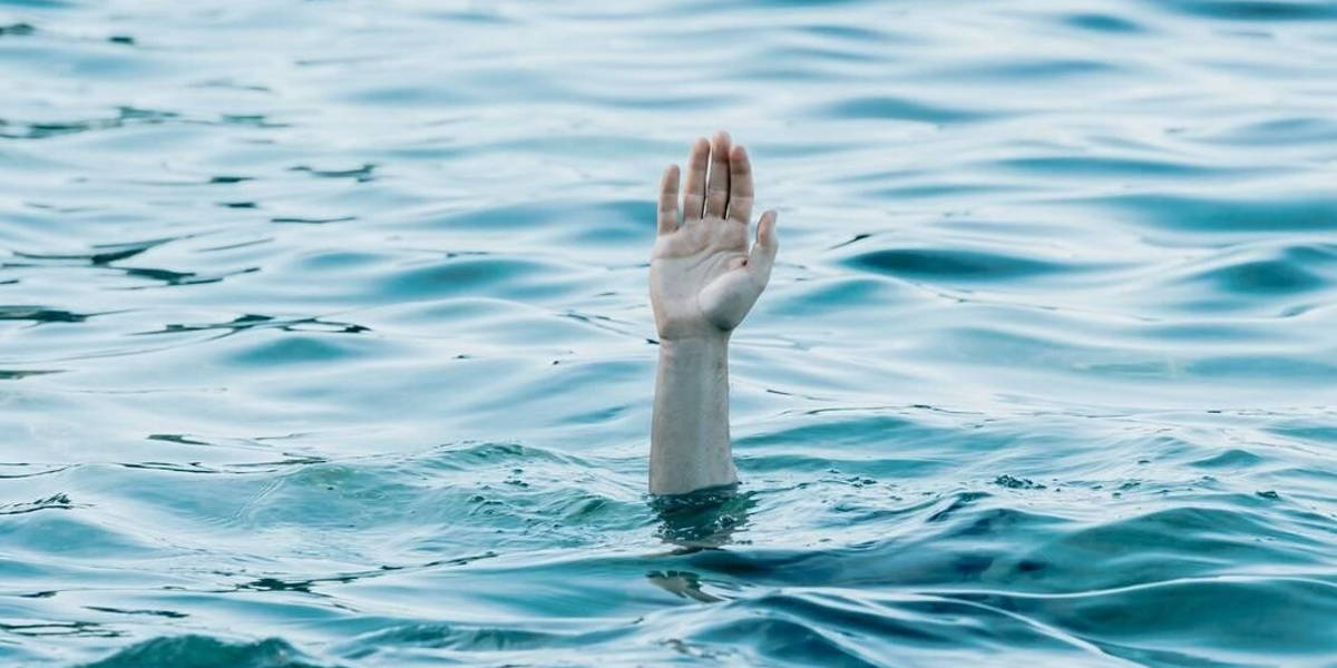 A hand showing out the ocean, rescue and help concept, self care, drown anxiety and problems conceptual image, copy space