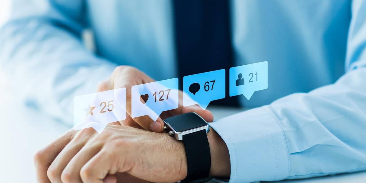 hands with smart watch and social media icons