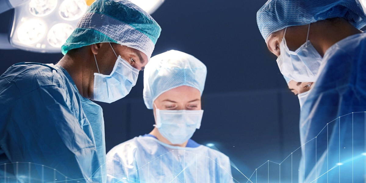 group of surgeons in operating room at hospital