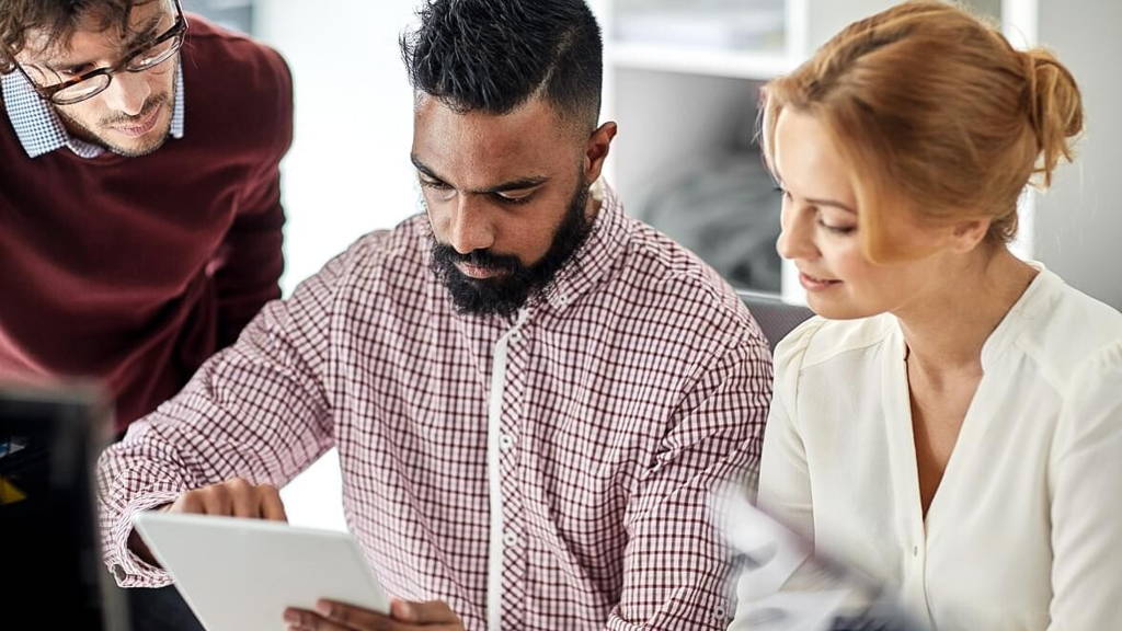 business team with tablet pc computer in office