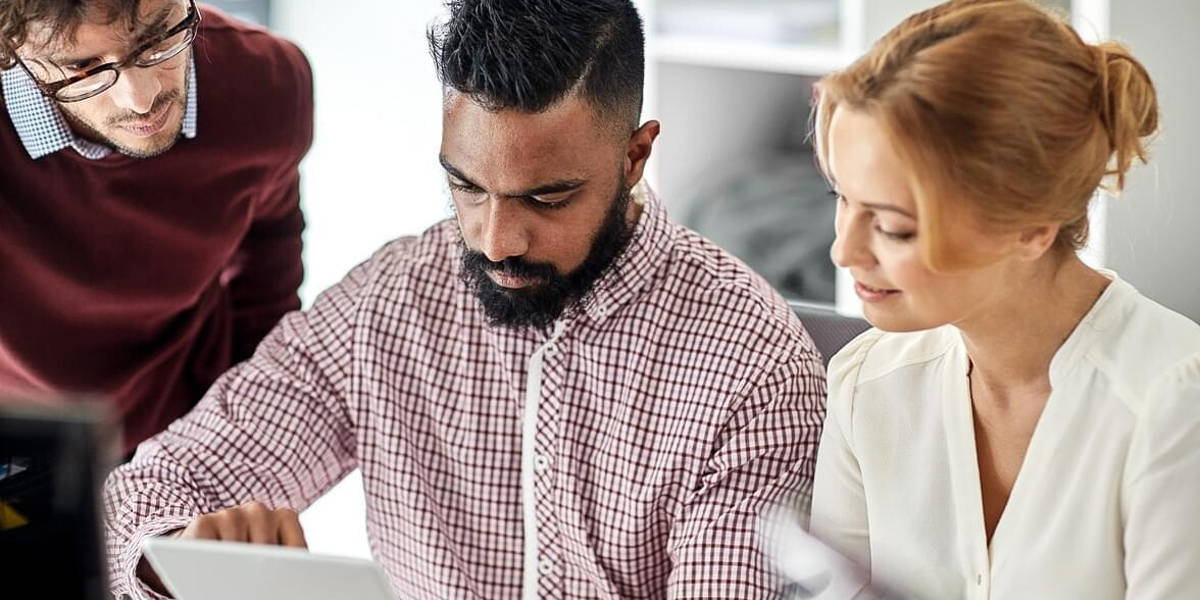 business team with tablet pc computer in office