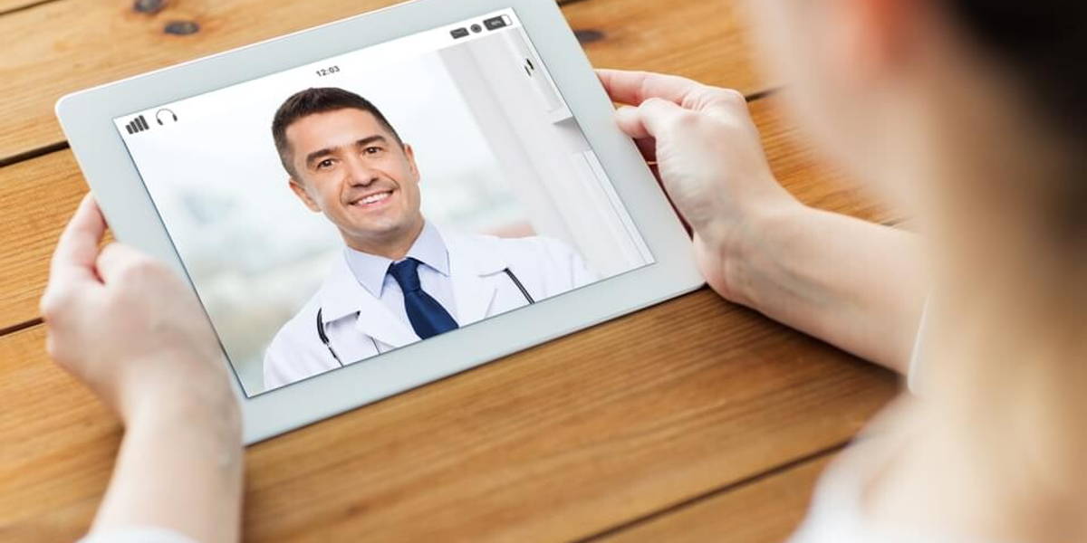 patient having video chat with doctor on tablet pc