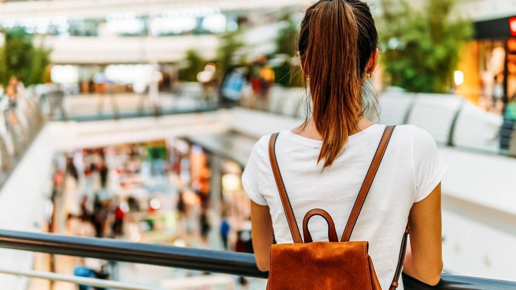Young Woman Exploring Modern Shopping Mall