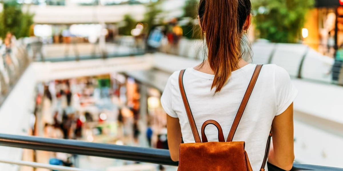 Young Woman Exploring Modern Shopping Mall