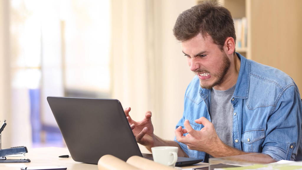 Entrepreneur angry and furious with laptop