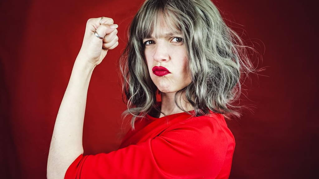 Young expressive woman in a classic feminist image