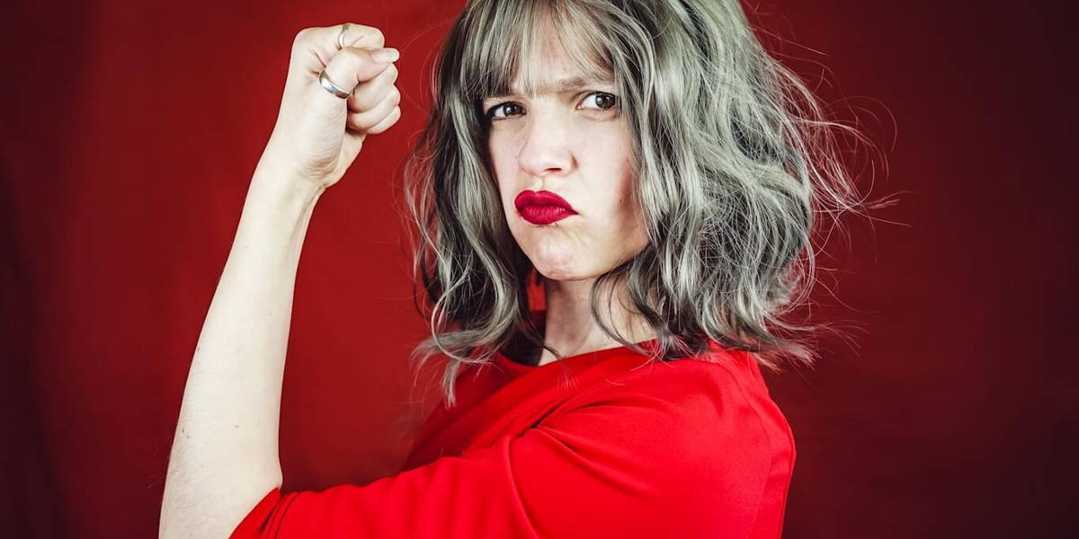 Young expressive woman in a classic feminist image