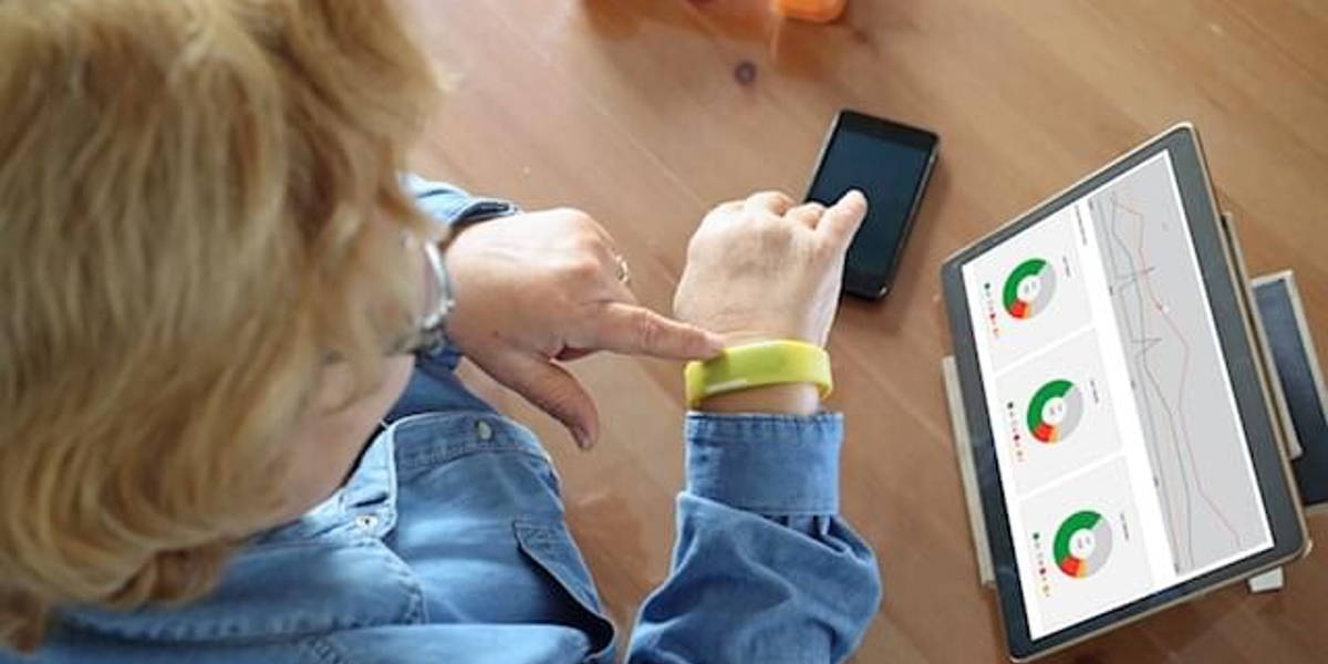 Senior woman using health technology