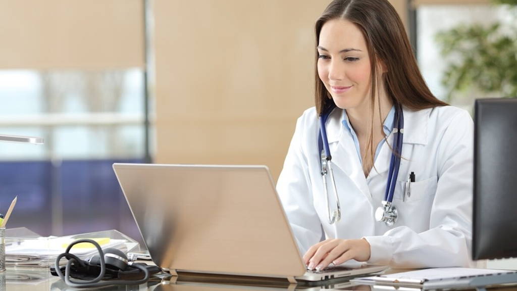 Doctor working on line in a consultation