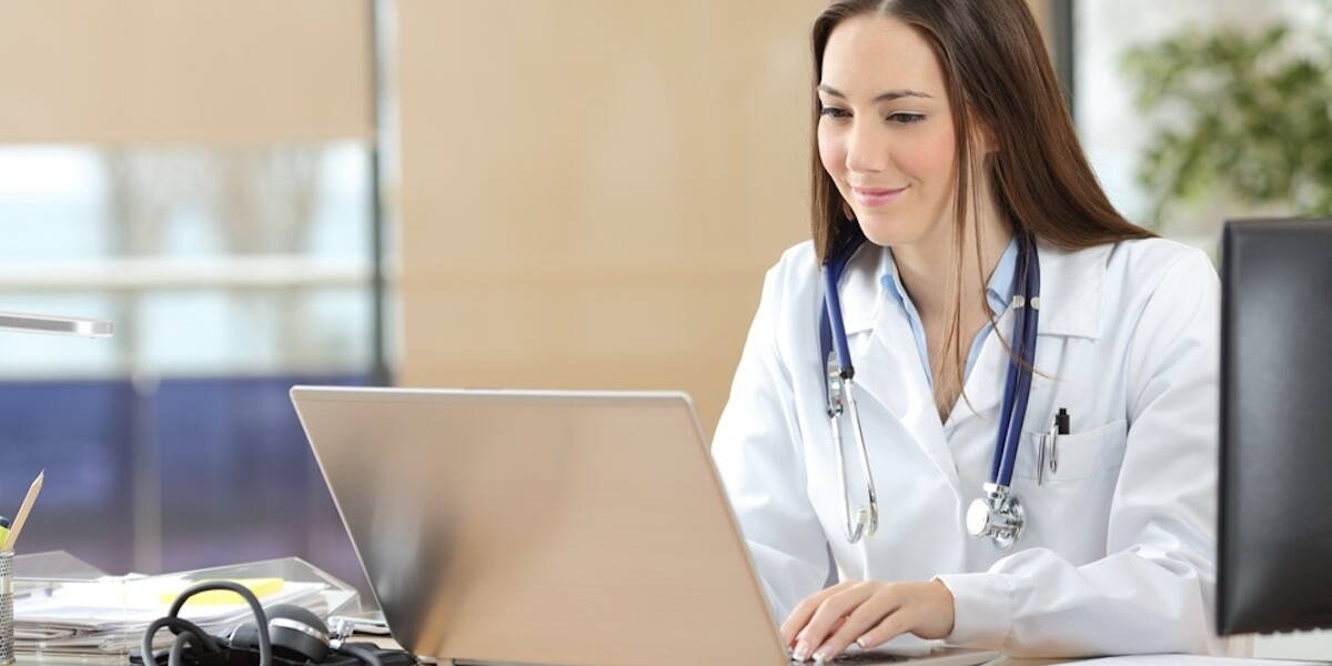 Doctor working on line in a consultation