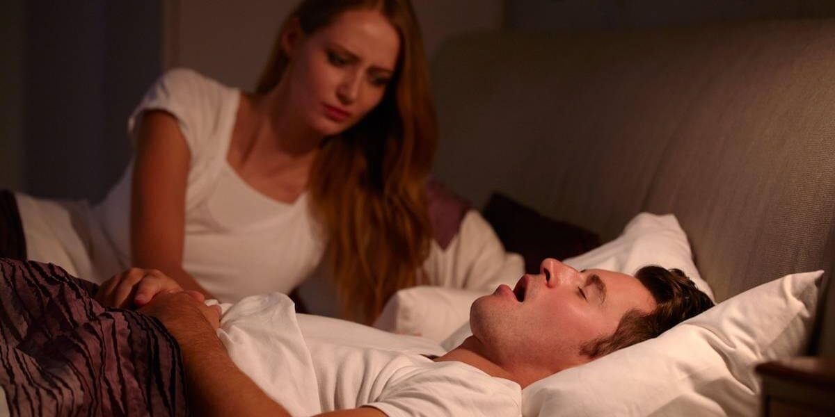 Woman Disturbed By Man's Snoring As They Lie In Bed