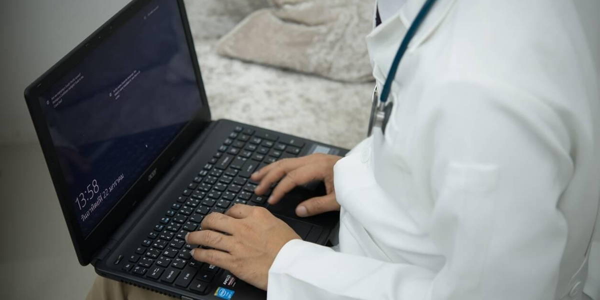 Doctor in hospital using a digital tablet while take a rest.