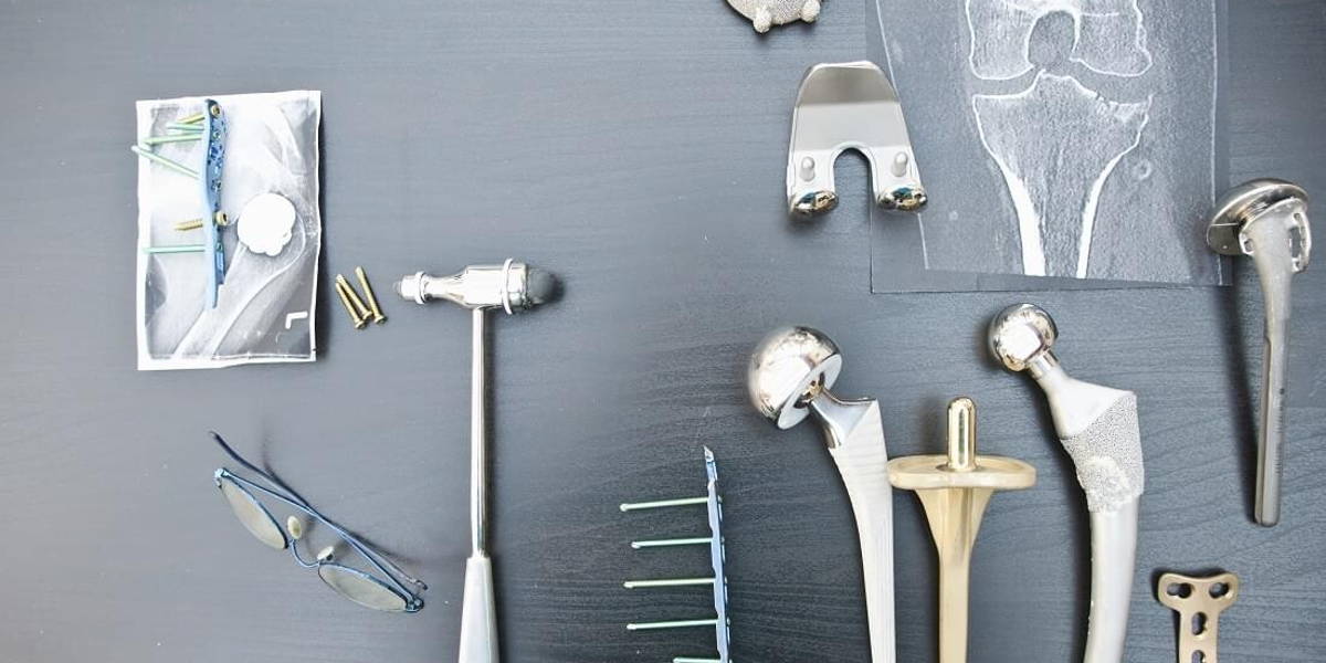 Desk of an orthopedic surgeon with different types of arthroplasties