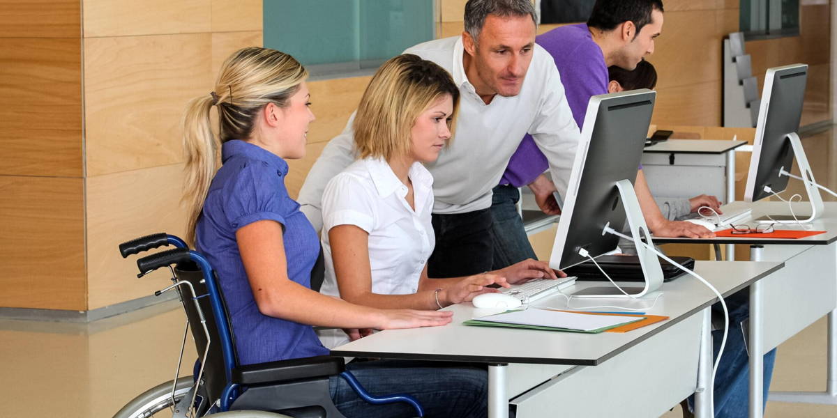 Woman in wheelchair working in the office