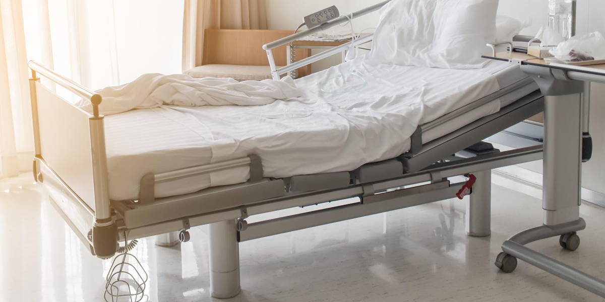 Soft focus background of electrical adjustable patient bed in ho