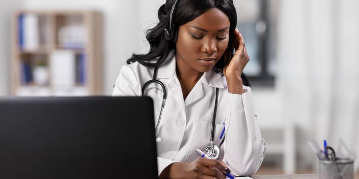 doctor with headset and clipboard at hospital