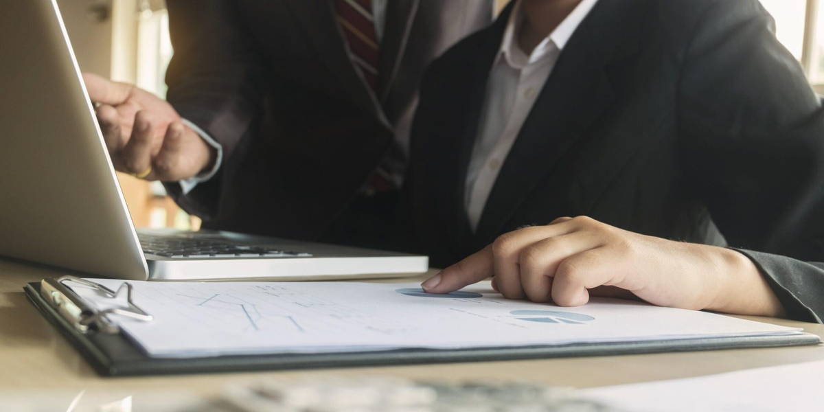 Business executives analysis data document with accountant at wo