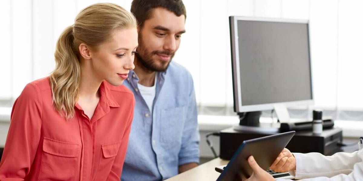 couple visiting doctor at family planning clinic