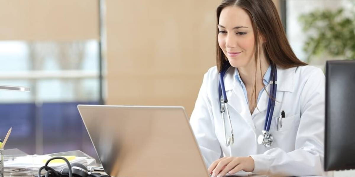 Doctor working on line in a consultation