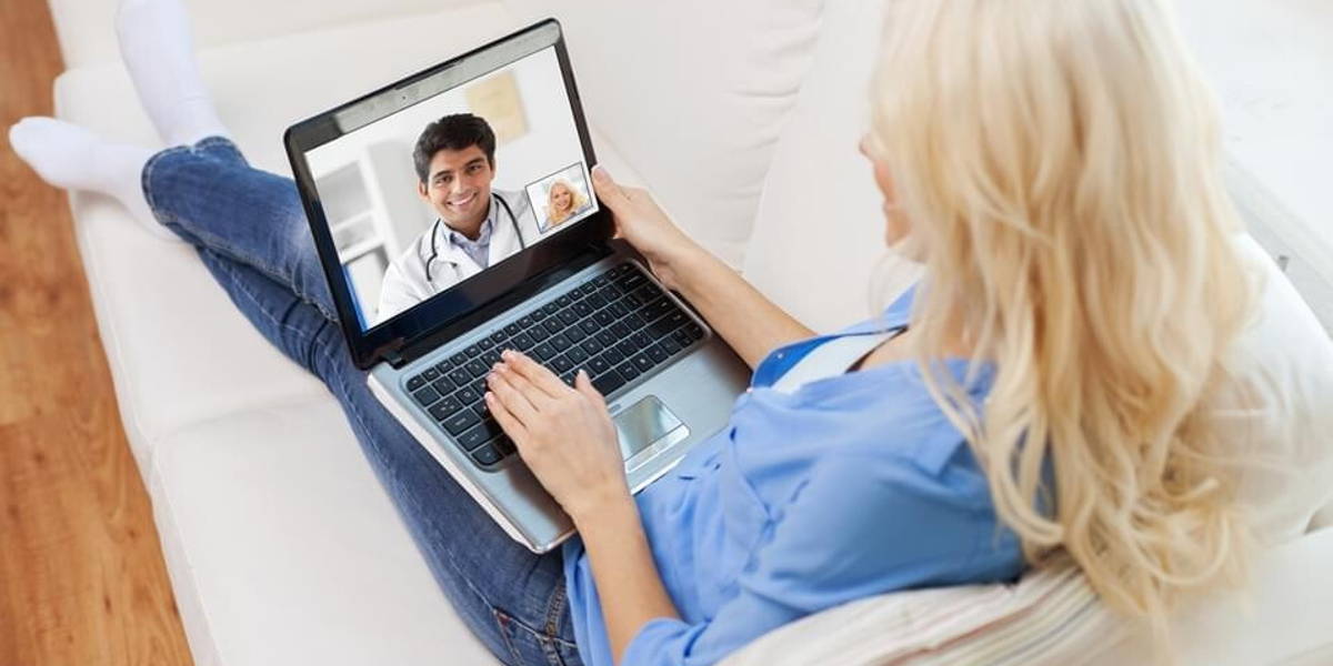 patient having video call with doctor on laptop
