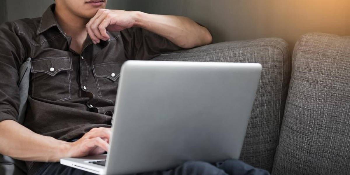 Businessman works on the sofa at home. Work searching for new id