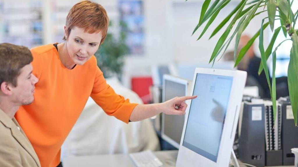 Businesspeople using computer