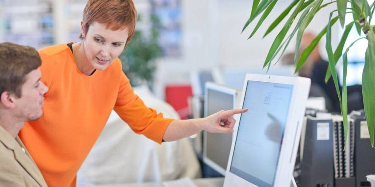 Businesspeople using computer