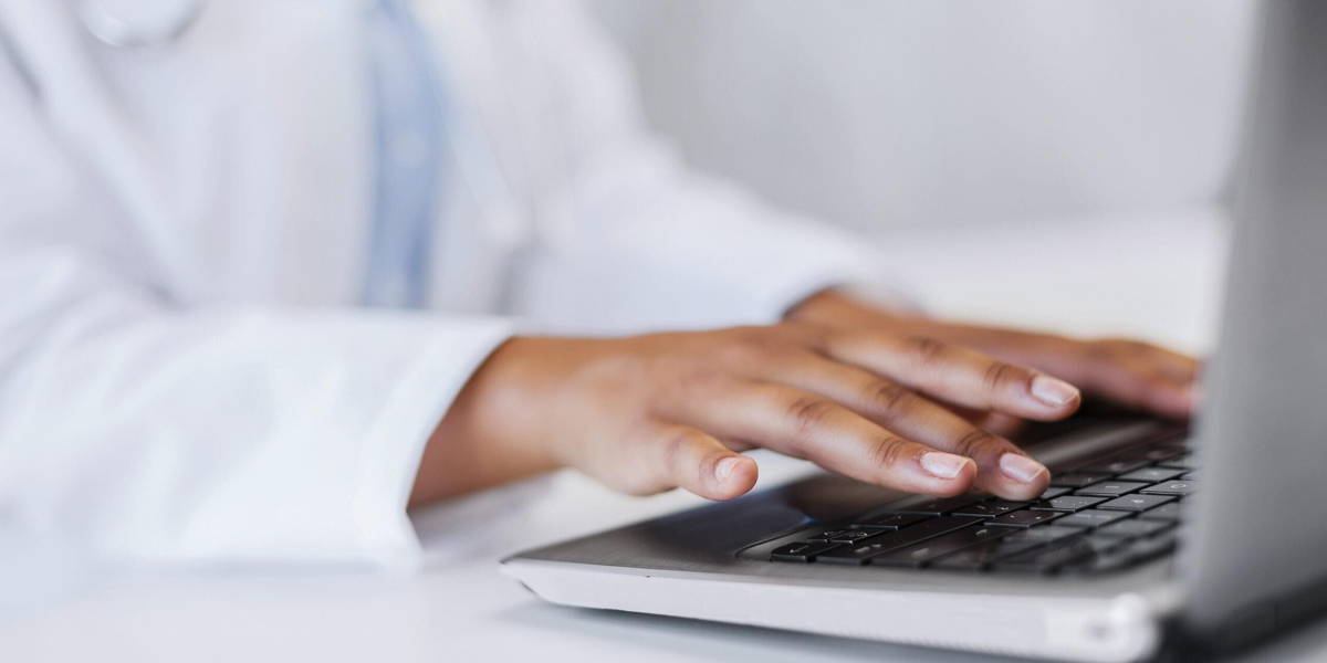 female doctor using her laptop computer