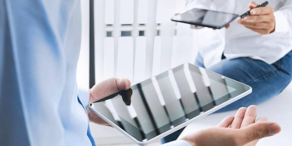 Business executives working together and using digital  tablet a