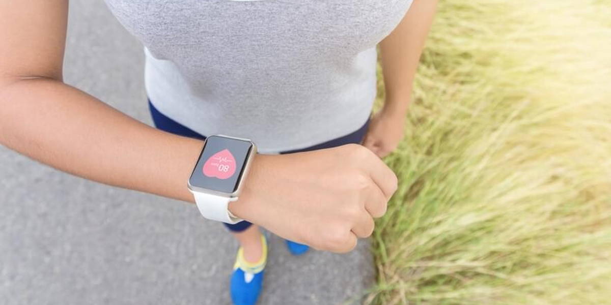 digital hand watch on sport woman hand