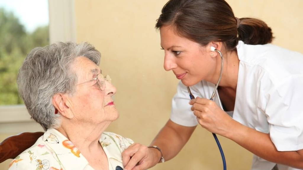 Elderly person with nurse