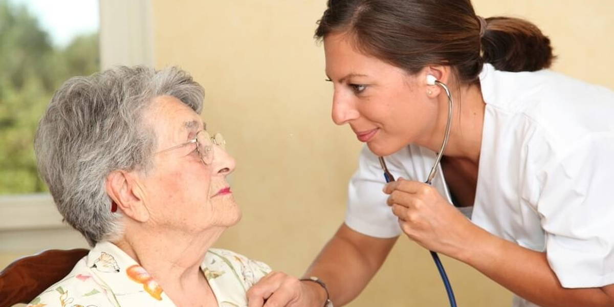 Elderly person with nurse