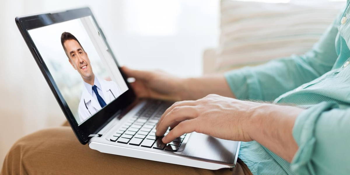 patient having video call with doctor on laptop