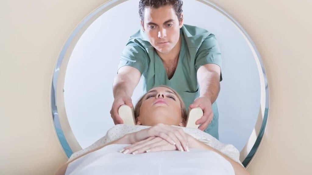Young woman going through CT test
