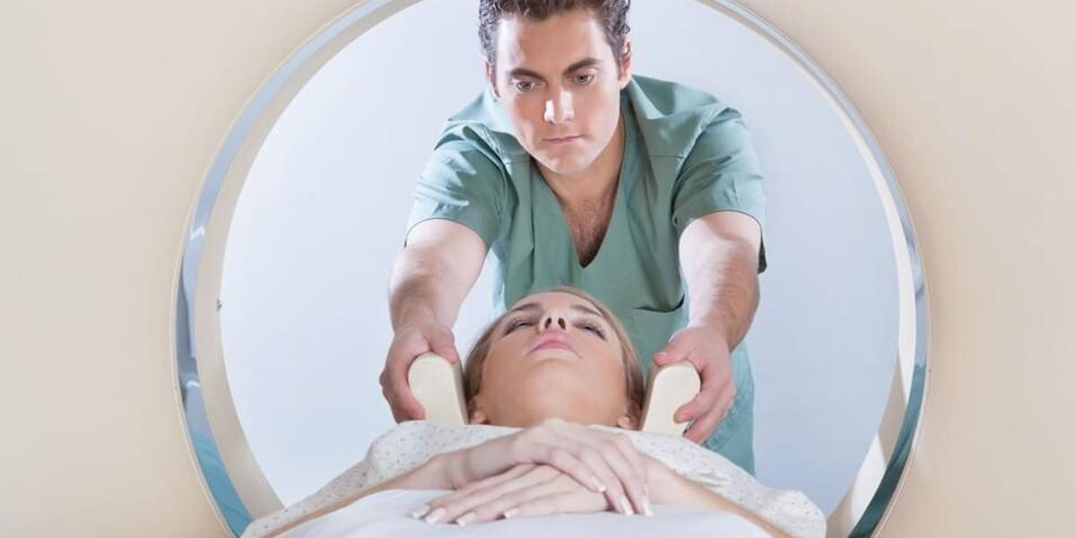 Young woman going through CT test