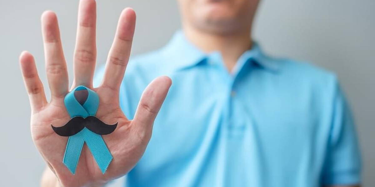 November Prostate Cancer Awareness month, Man holding Blue Ribbo