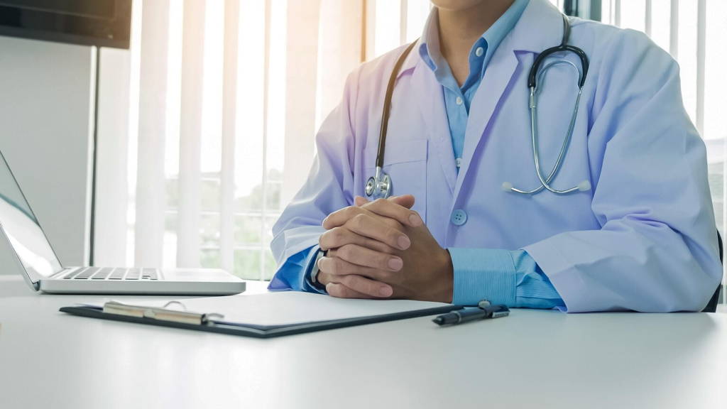 patient listening intently to a male doctor explaining patient s