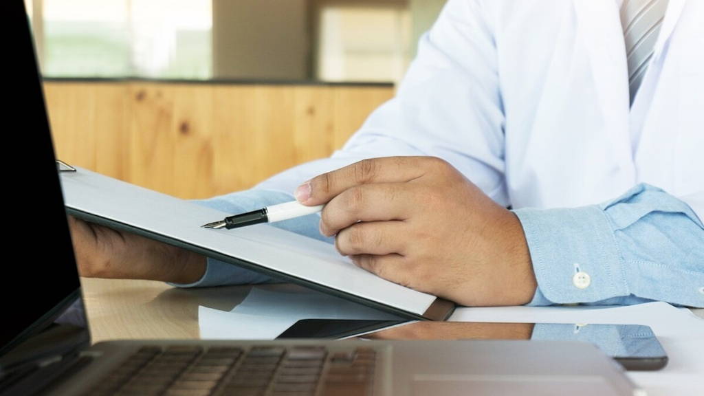 Medical technology network team meeting concept. Doctor hand working smart phone modern digital tablet laptop computer graphics chart interface