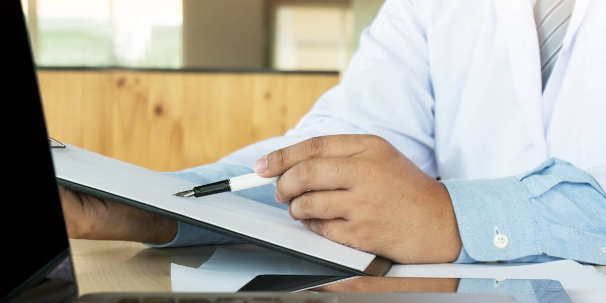 Medical technology network team meeting concept. Doctor hand working smart phone modern digital tablet laptop computer graphics chart interface